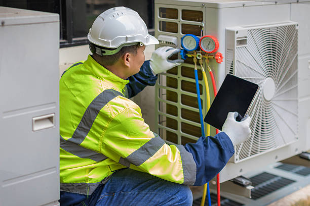 Professional Air Conditioning Repair technician working in Royal Center, IN
